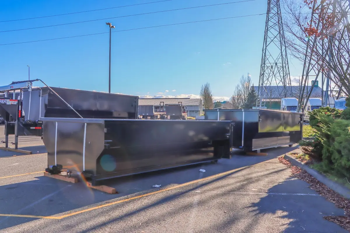 Roll-off dumpster ready for waste disposal at job site for 2 Yard Dumpster Rental in Manchester